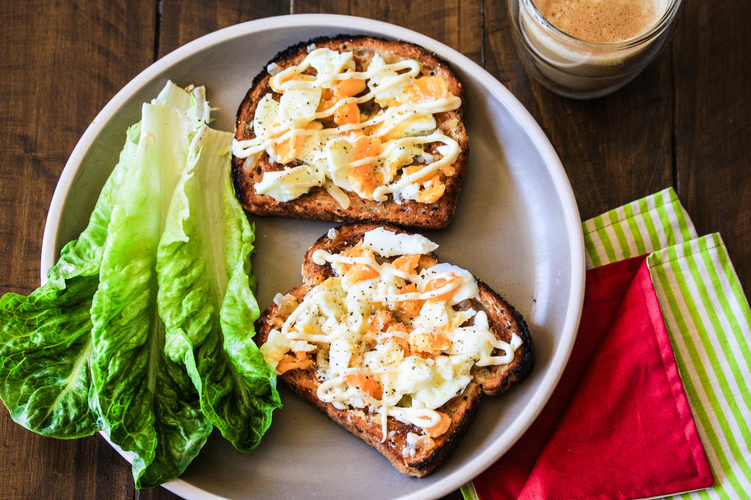 Toast with eggs, butter, cheese, mayo and greens